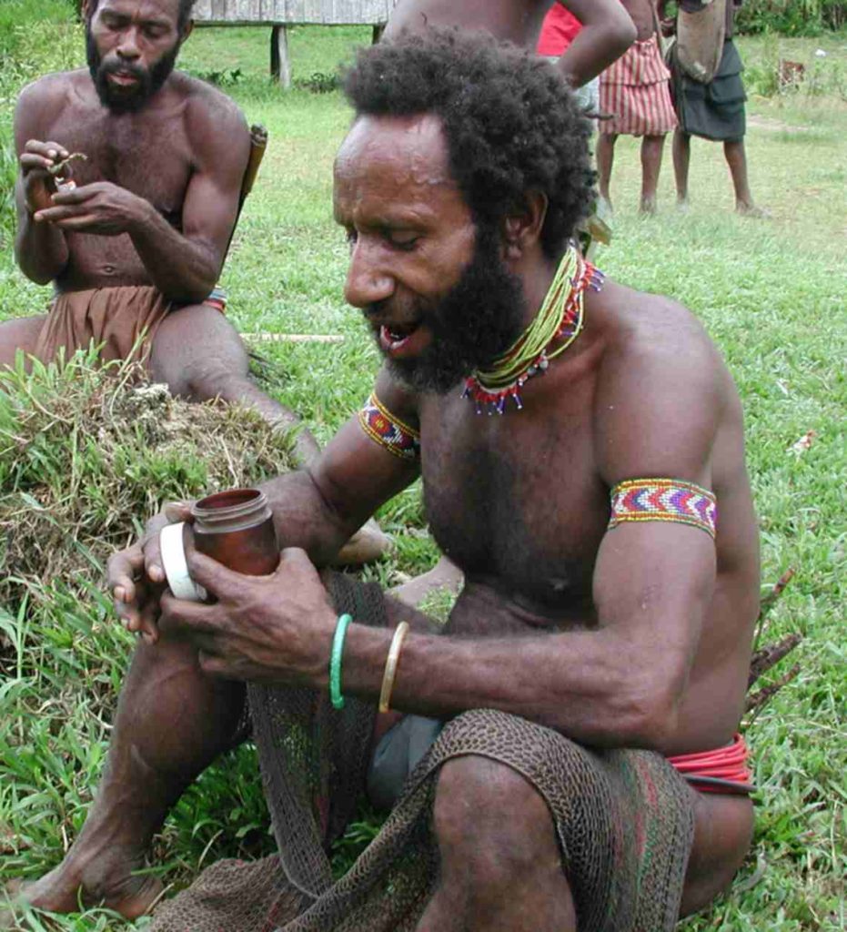 Malaumandan men chewing beetle nut in typical, daily dress.